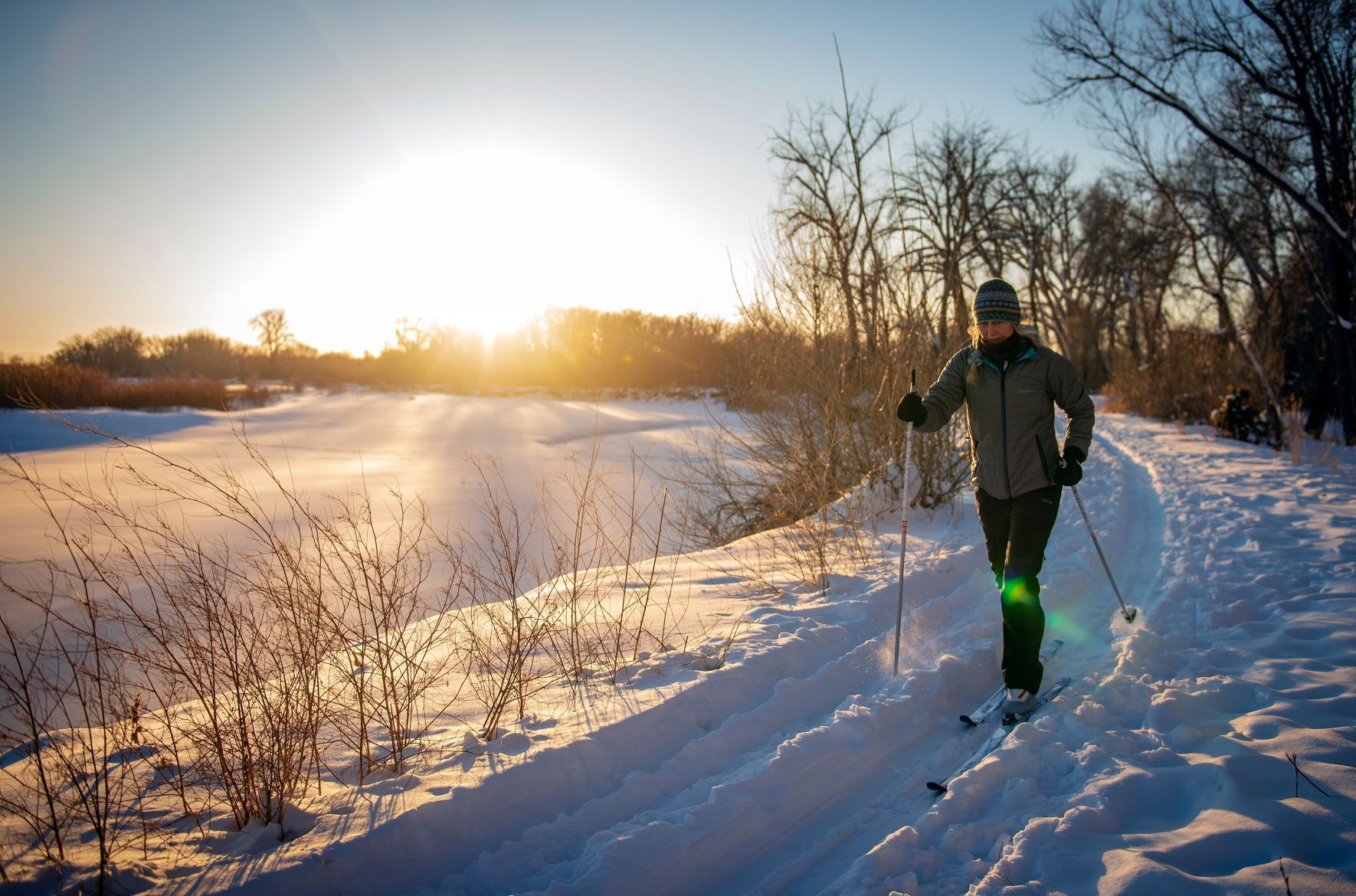 Skiing along the river bank